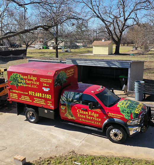 Clean Edge Tree Service and Removal, LLC truck in a driveway